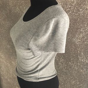 Cute gray slight cropped shirt. Very stretchy